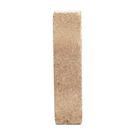 Single pale buff Westminster clay brick paver standing upright and revolving to show texture. Free UK delivery available.
