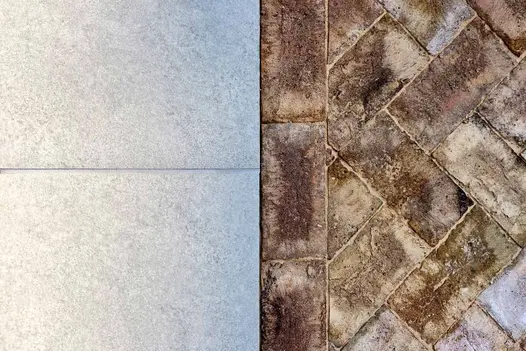 Split shot close-up of Astor Grey porcelain and belgian bricks, showing textures and colour variations.