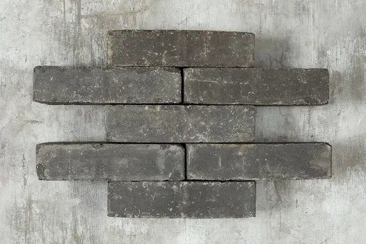 7 grey Lucca brick pavers arranged in alternating rows of 1 and 2. Part of the Kessel Clay Paving collection.