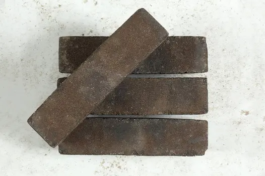 3 Ancona Clay Pavers, with 4th brick set at angle on top, showing dark brown and grey colouring. Free next-day delivery available.