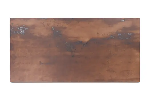 Single panel of Siena Copper 1200x600 porcelain external cladding, showing metallic-type markings and brown tones.