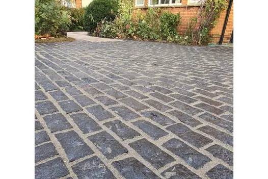 Close up view of Natural Black Granite Setts shows off natural texture, colour and variations.