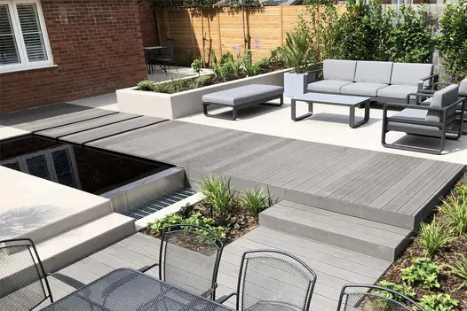 Charcoal WPC decking boards and Florence Grey porcelain pave back garden designed by Dru Allen, built by Limebok Landscaping.