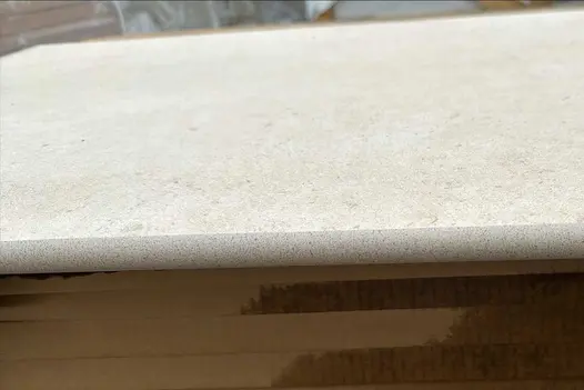 Close up of the bullnose on a single Florence Beige 20mm Moulded off the shelf Step, showing texture.