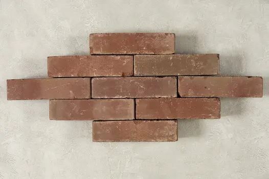 Nine Roma Clay pavers laid on their side on light background, showing colour and texture. Free UK delivery available.