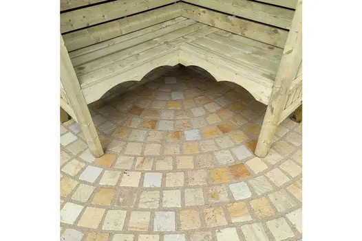 Right-angled wooden bench sits on white and yellow tones of mint sandstone setts with wide pointing in design by Katarina Kantalis.