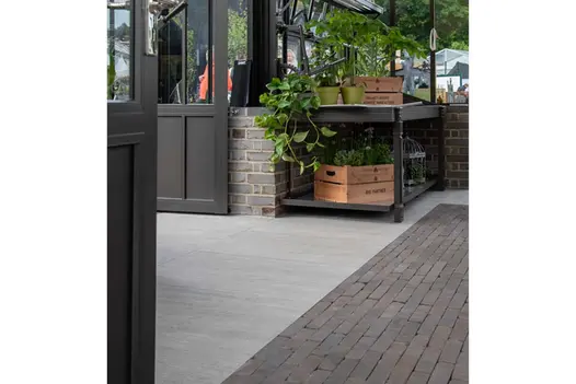 Lugano Clay Pavers and paving tiles laid in Hartley Botanic greenhouse with staging and wooden boxes. Built by Stewart Landscape.