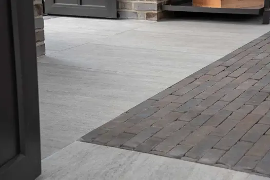 Lugano Dutch Clay Pavers laid with grey porcelain tiles by Stewart Landscape Construction at RHS Chelsea 2022. Design by Llevelo.