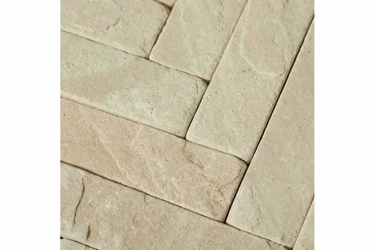 Close-up shot of Tumbled Mint Sandstone Pavers, displaying the unique texture and colour variations of the stone pavers used as patio bricks.