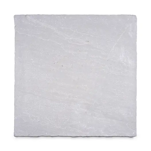 Single slab of Kandla Grey tumbled Indian sandstone paving, seen from above, showing colour and riven texture.