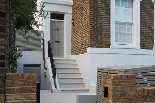 36mm thick Faro Porcelain Steps with a bullnosed edge, leading down from a typical London Georgian townhouse. No plants visible.
