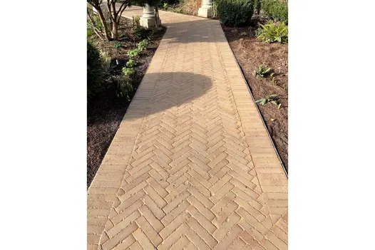 Clay Paving path in Westminster Belgian bricks laid herringbone between 2 soldier courses. Bed on each side. Design by Kate Gould.